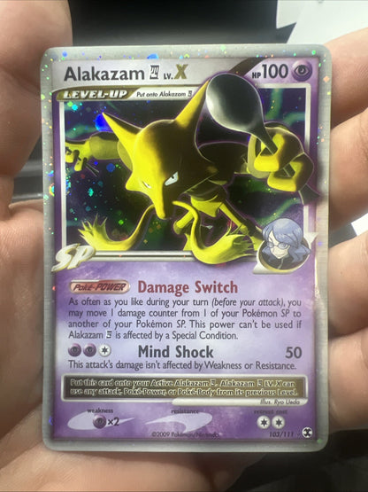 Pokeomn Alakazam Lv.X 103/111 Rising Rivals Holo - LIGHT PLAY